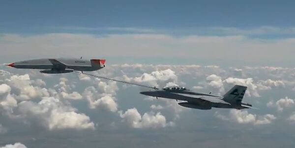 A screenshot from a Boeing video showing the first refuelling contact between MQ-25 T1 and a Super Hornet receiver aircraft on 4 June. (Boeing)
