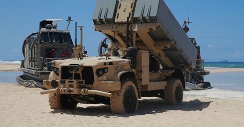 A Navy Marine Expeditionary Ship Interdiction System (NMESIS) launcher deploys into position aboard Pacific Missile Range Facility Barking Sands, Hawaii, on 16 August. The NMESIS and its Naval Strike Missiles participated in a live-fire exercise during...