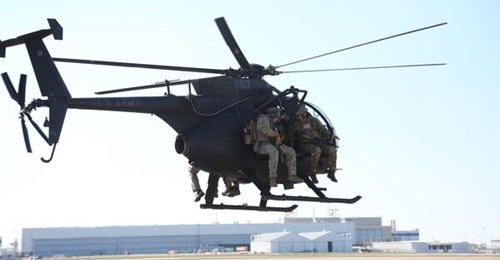 Operators from US Army's 10th Special Forces Group conduct aviation insertion training with an AH-6 Little Bird at Fort Carson, Colorado.