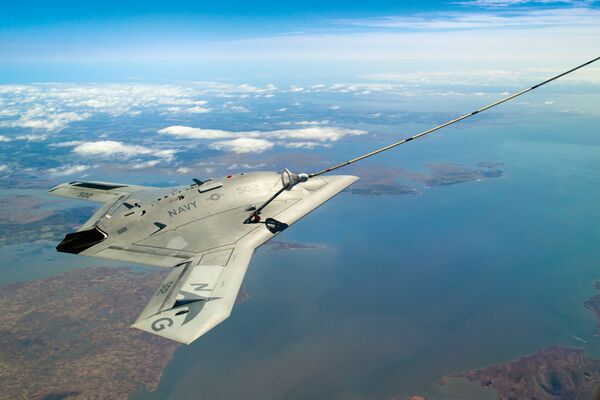 X-47B successfully completes the first autonomous aerial refuelling demonstration over the Chesapeake Bay on 22 April. (US Navy)