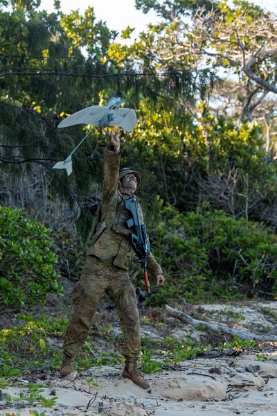 An Australian Army trooper launches a Wasp AE UAV during an exercise in Queensland in August 2021. The Australian Army has contracted three companies from eastern Australia to develop UAVs that can support logistics operations as it accelerates efforts...