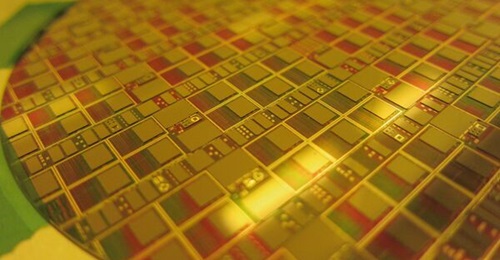 DARPA's Diverse Accessible Heterogeneous Integration effort is developing transistor-scale heterogeneous integration processes seeking to combine advanced compound semiconductor wafers with CMOS technology. Pictured here is a DAHI wafer.