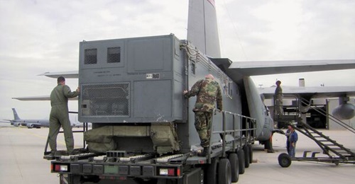 One of the USAF's trio of legacy 'Senior Scout' SIGINT shelters being loaded into a fixed-wing transport aircraft.