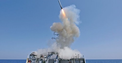 The Arleigh Burke-class guided-missile destroyer USS 
        
        is seen here launching a Tomahawk cruise missile. Japan is seeking to accelerate its acquisition of this capability.