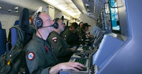 US Navy personnel crew the workstations of a P-8A Poseidon maritime patrol aircraft of the type that NATO has likely committed to increased aerial patrols of the Baltic Sea.