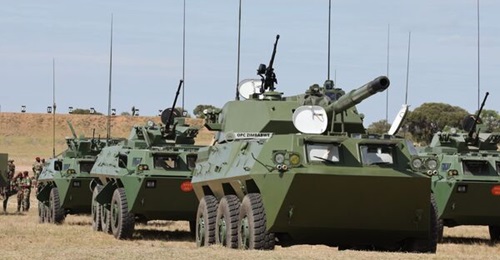 WZ551 armoured vehicles lined up behind a WMA301 self-propelled gun at a range in Inkomo.