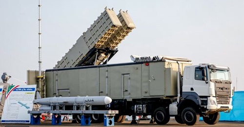 The Talaiyeh long-range anti-ship missile is seen next to its launcher during the ceremony at Konarak naval base.