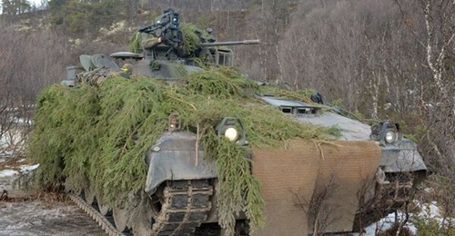 A German Army Marder 1A5 ready to engage a target with its EuroSpike MELLS anti-tank guided weapon mounted to the right of the 20 mm cannon.