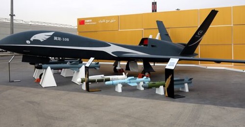 The AVIC Wing Loong-10B (WL-10B) displayed at WDS 2024 along with various missiles and bombs.