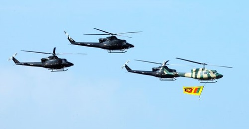 A Bell 212 and three Bell 412EP helicopters of the Sri Lanka Air Force's No 4 (VVIP/VIP) Helicopter Squadron fly over Colombo on 4 February 2024. Sri Lanka is planning to induct new helicopters to bolster its rotary-wing capabilities.