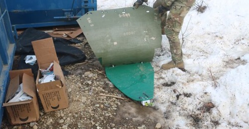 The US Army's medical evacuation sled includes an extra piece of plastic bolted on to provide cover for patients being pulled by snow machine.