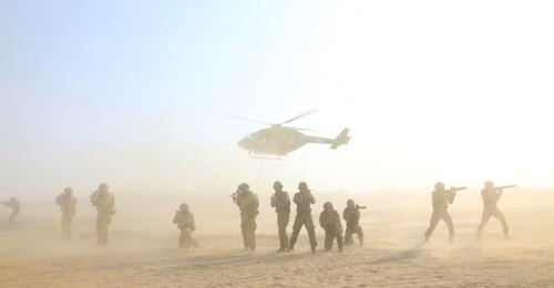 The HAL Dhruv ALH has become a mainstay of the Indian Army's rotary-wing capabilities. In this image, an Indian Army Dhruv hovers as Australian Army troops from the 13th Brigade conduct a drill in India in 2022.