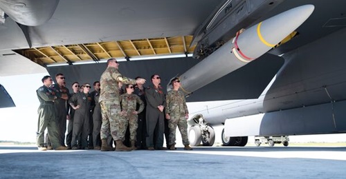 US B-52 Stratofortress crews look at an AGM-183 ARRW during a hypersonic weapon familiarisation briefing at Andersen Air Force Base, Guam, on 27 February. The yellow bands on the missile indicate that it is a live round.