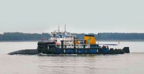 A composite image produced from multiple screengrabs taken from video footage posted on the TikTok social media platform in about mid-June showing a new conventionally powered submarine for the Chinese navy.