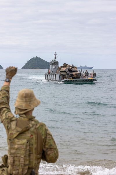 A Royal Australian Navy LHD landing craft carries an M1A1 Abrams main battle tank from HMAS 
        
         during an amphibious beach assault, as part of Exercise 'Sea Explorer'.