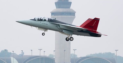 Saab, Inc builds the aft fuselage for the US Air Force's T-7 jet trainer at a new facility in West Lafayette, Indiana. Above, the T-7 engineering and manufacturing development aircraft takes off from St Louis on its first flight in June 2023.