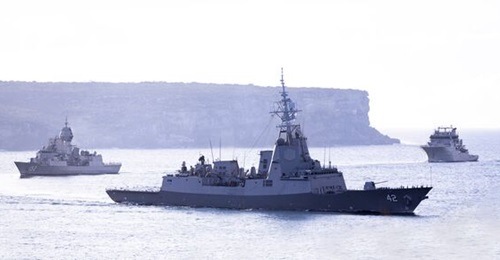 HMAS 
        
        , seen here with the Naval Strike Missile launcher on its starboard side, as it carries out a formation entry into Sydney Harbour with HMAS 
        
         and New Zealand's HMNZS 
        
        .