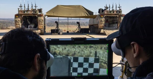 AIM Defence employees operate the AIM Defence Counter-UAS Directed Energy Weapons System during a demonstration at the Puckapunyal Military Area, Victoria.