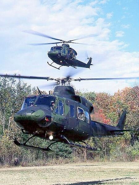 Two pre-modification Bell CH-146s. The full RCAF fleet of 85 Griffons is to be upgraded to C standard.