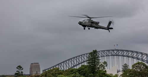 Australia is slated to start receiving the first of 29 ordered Boeing AH-64E Apaches from 2025. This image shows a US Army AH-64E over the Sydney Harbour Bridge in February 2022.