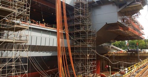 HII shipyards, like Newport News Shipbuilding shown here during construction of the aircraft carrier, 
        
        , need experienced workers.