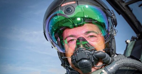 A BAE Systems test pilot models the Striker II HMD for the Eurofighter. Originally a UK project among the Eurofighter partner nations, the Striker II will not be fielded also by Germany and Italy, with Spain yet to decide.