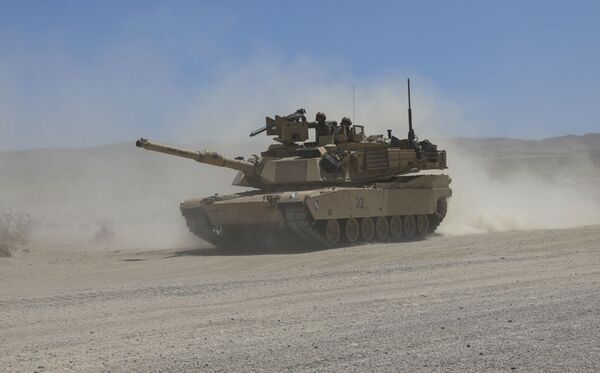 An M1A2 Abrams tank assigned to the 155th Armored Brigade Combat Team with the Mississippi Army National Guard manoeuvres through ‘the box' on 8 June at the National Training Center at Fort Irwin, California. The US Army has requested less funding for Abrams upgrades next year and that will affect the National Guard. (US Army)