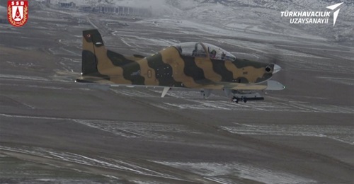An example of Turkey's locally developed Hurkus-C basic trainer/light attack aircraft, carrying weaponry and defensive systems to facilitate close air support missions, has successfully completed flight and firing trials.
