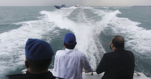 Chief Minister of Johor, Osman Sapian (centre), surveying the disputed waters in a Malaysia Marine Department vessel, with patrol boats from the Malaysia Maritime Enforcement Agency (MMEA) and the Singapore Police Coast Guard (background) tailing behind.