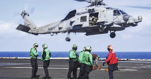 The MH-60R Seahawk helicopter, assigned to the 'Proud Warriors' of HSM 72, prepares to land aboard the Nimitz-class aircraft carrier USS 
        
         in November 2018. The USN is going ahead with plans to build a new, FVL light- to mediu...