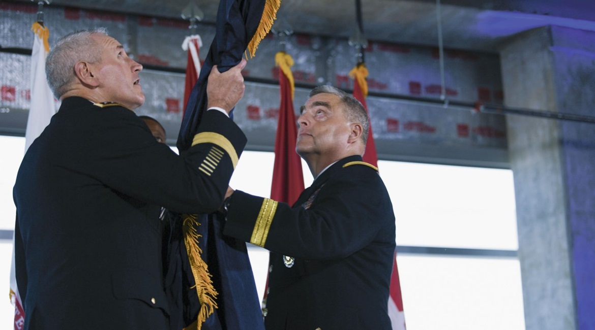 US Army General Mike Murray, commander of Army Futures Command, and Chief of Staff of the Army General Mark Milley unfurl the Army Futures Command flag during a ceremony last August. Gen Milley has been nominated to be the next chairman of the Joint Ch...