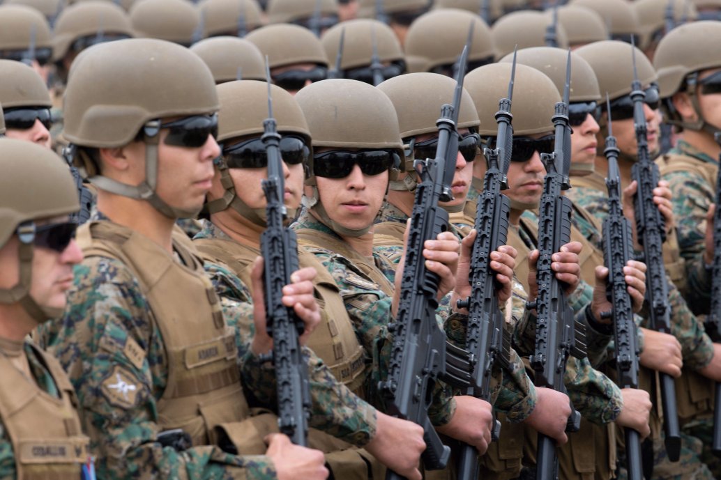 Chilean troops on parade in Santiago for Chile’s 208th independence anniversary on 19 September 2018. A Chilean initiative to reduce pension costs by extending military service terms could save USD500 million over the next 30 years. (C Reyes/AFP/Getty Images)