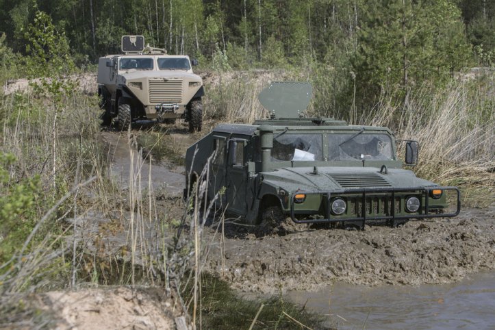 An AM General Humvee and a Sisu Auto GTP under evaluation in Latvia in May 2018. (Latvian MoD)