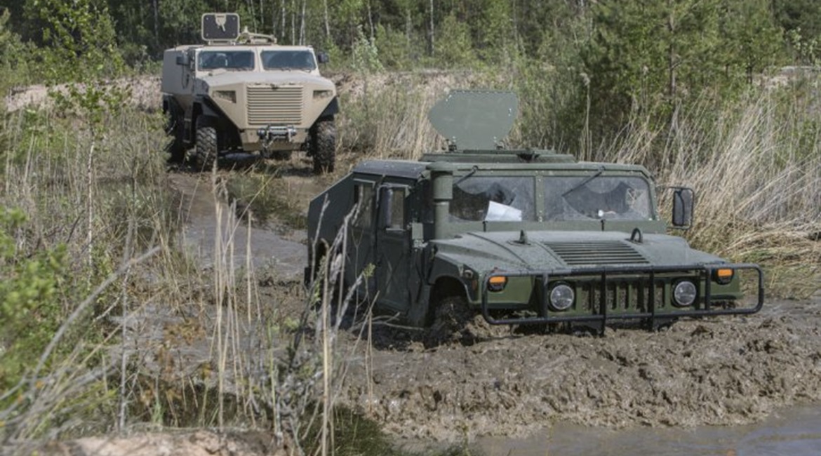 An AM General Humvee and a Sisu Auto GTP under evaluation in Latvia in May 2018.
