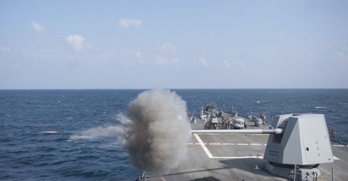 The USN Arleigh-Burke class guided-missile destroyer USS 
        
         (DDG 109) fires its MK 45 5-inch gun during a gunnery exercise in the Gulf of Aden in 2018.