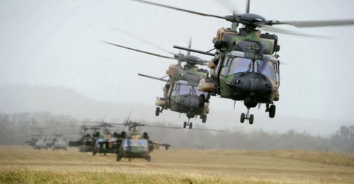 Australia will transition its special forces helicopter capability from the Black Hawk (background) to the MRH90 (foreground) by the end of November 2021.