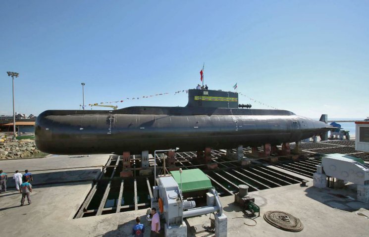 Iran’s Fateh-class submarine seen out of the water at the Bostanu shipyard in a photograph released but not taken on 17 February. It is missing the foreplanes that were seen on its hull in previously released television footage. (Islamic Republic News Agency (IRNA))