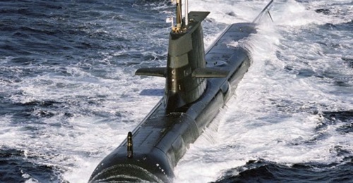 Collins-class submarine HMAS 
        
         at sea off western Australia. The Collins class could now end up staying in service into the 2030s.