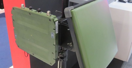 The Harris RF-7850W HCLOS, which now has a frequency-hopping capability, displayed at IDEX 2019. The radio is on the left and the point-to-point antenna on the right.
