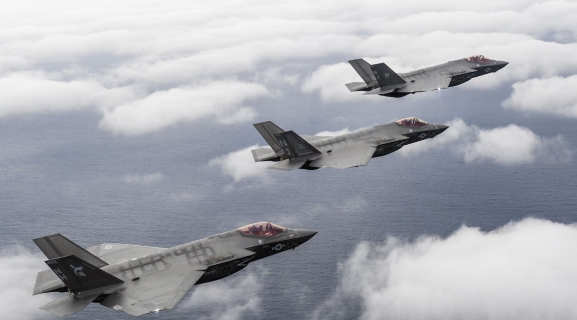 Three F-35C aircraft attached to the 'Argonauts' of Strike Fighter Squadron (VFA) 147, the 'Rough Raiders' of VFA 125, and the 'Grim Reapers' of VFA 101 fly over Eglin Air Force Base in Florida ahead of the declaration of IOC on 28 February.