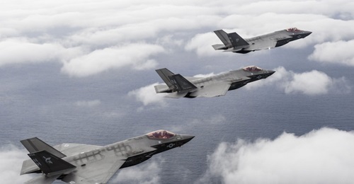 Three F-35C aircraft attached to the 'Argonauts' of Strike Fighter Squadron (VFA) 147, the 'Rough Raiders' of VFA 125, and the 'Grim Reapers' of VFA 101 fly over Eglin Air Force Base in Florida ahead of the declaration of IOC on 28 February.