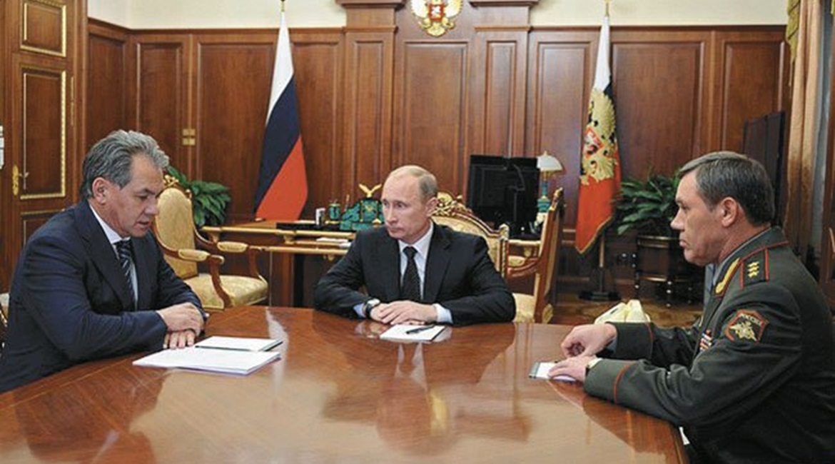 Russian Chief of the General Staff Gen Gerasimov (right) pictured with President Vladimir Putin (centre) and Defence Minister Sergei Shoigu. The general has been responsible for many of the changes in Russia's armed forces that have turned it into an a...