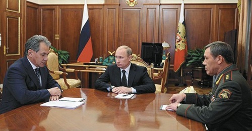 Russian Chief of the General Staff Gen Gerasimov (right) pictured with President Vladimir Putin (centre) and Defence Minister Sergei Shoigu. The general has been responsible for many of the changes in Russia's armed forces that have turned it into an a...