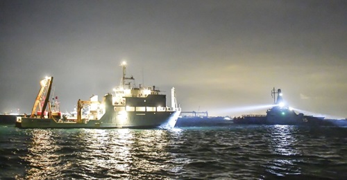 Singapore's Littoral Mission Vessel RSS  (right), keeping an eye on Malaysian Marine Department ship MV , off Tuas.