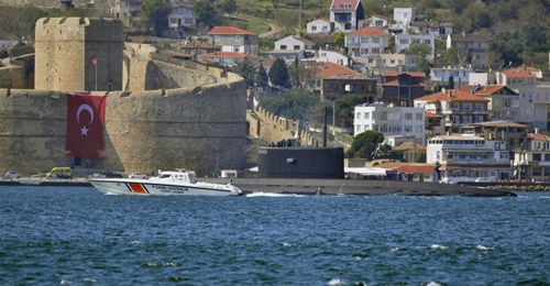 A Russian Project 636.3 'Kilo'-class diesel-electric submarine - identified by Turkish ship spotters as 
        
         - is escorted by a Turkish Coast Guard vessel as it makes a southbound transit through the Dardanelles on 15 March.
