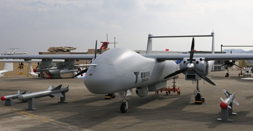 The twin-engined TB001 unmanned aerial vehicle shown alongside new anti-ship and ground-attack precision munitions at Airshow China 2018.