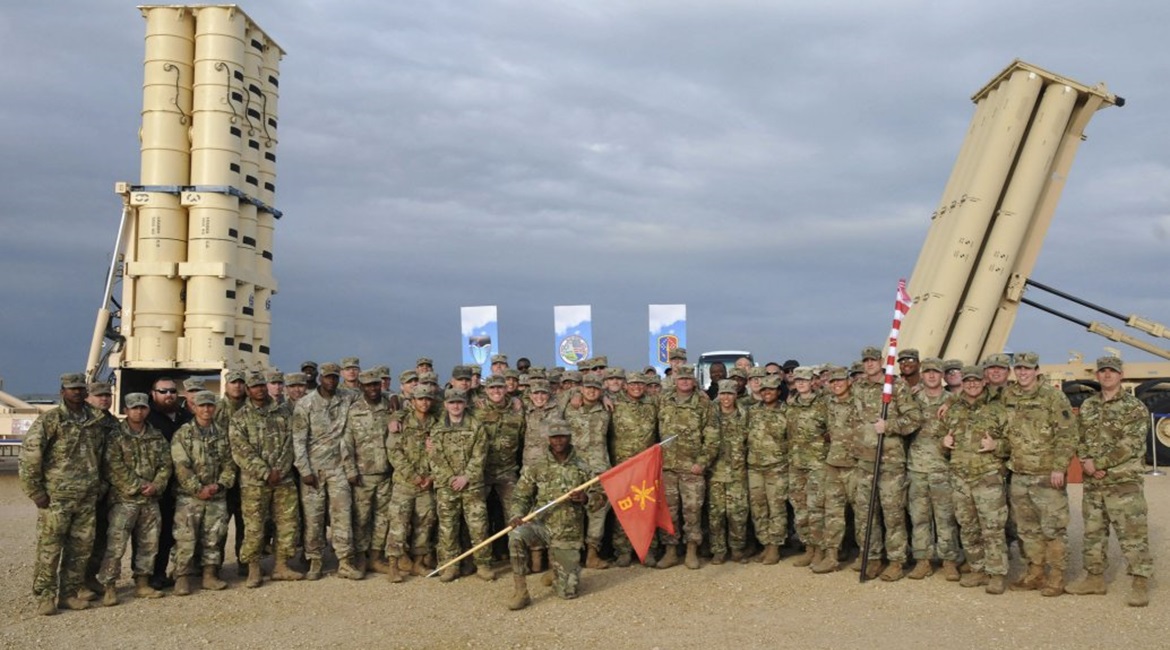 US Army soldiers during the closing ceremony held on 25 March for an exercise involving the deployment of a THAAD battery to Israel. A THAAD launcher can be seen on the right, one from the Israeli Arrow system on the left.