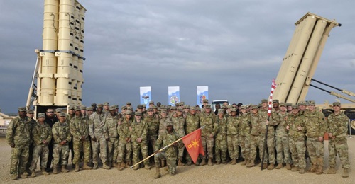 US Army soldiers during the closing ceremony held on 25 March for an exercise involving the deployment of a THAAD battery to Israel. A THAAD launcher can be seen on the right, one from the Israeli Arrow system on the left.