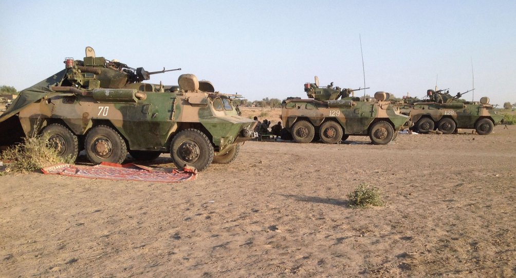 Four Chinese-made WZ523 armoured personnel carriers (APCs) are seen near Fotokol in northern Cameroon on 1 February 2015. They were probably part of a batch of 10 surplus vehicles delivered in 2007. The operation in early 2015 involved them driving across northern Cameroon to attack Boko Haram militants in northeast Nigeria. (Stephane Yas/AFP/Getty Images)