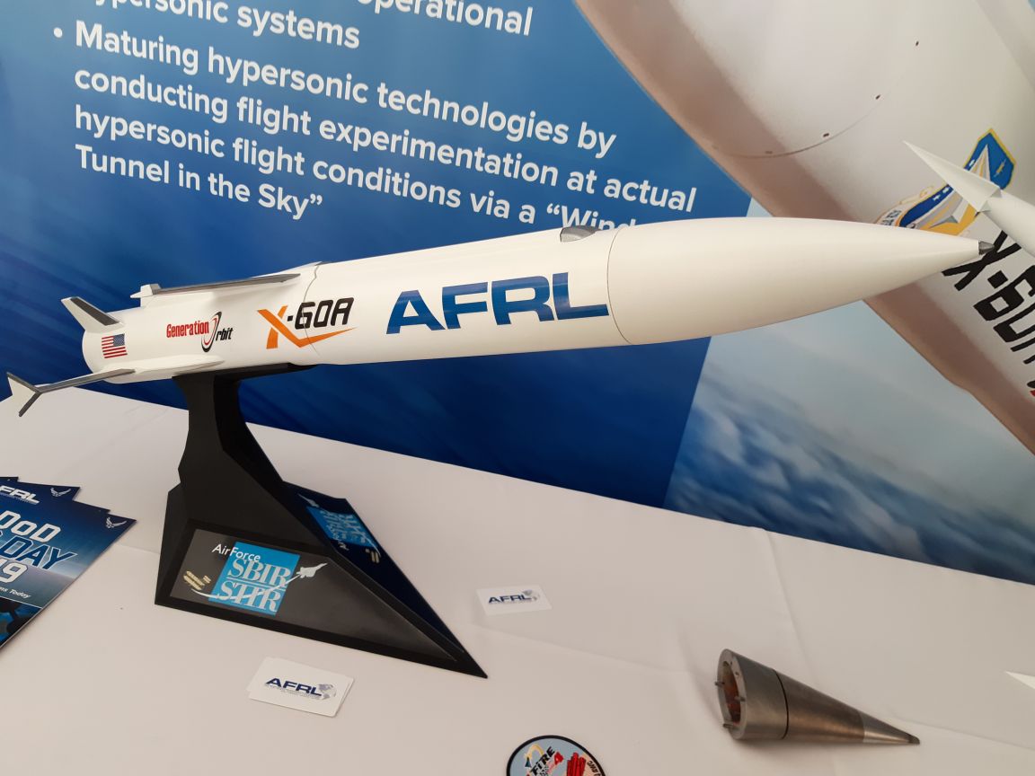 A model of the X-60A on display at AFRL's Lab Day at the Pentagon on 25 April 2019. The silver nosecone in the lower right of the photo is the nose tip from a different hypersonic test flight called HiFire-5. (IHS Markit/Pat Host)